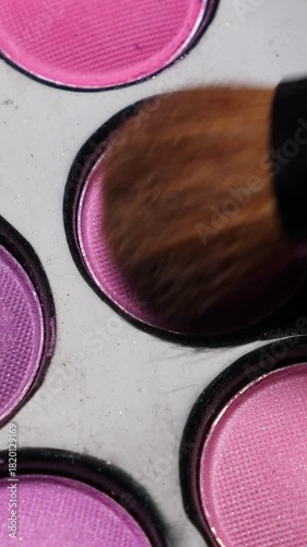 Professional makeup eyeshadows palette and brushes for make-up artist, closeup. Rotation. Vertical footage