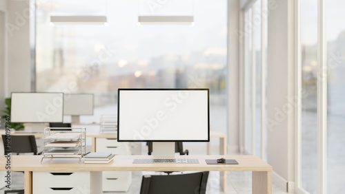 Fototapeta Naklejka Na Ścianę i Meble -  Blank screen computer and document on wooden drawer table and chair in office company workplace room