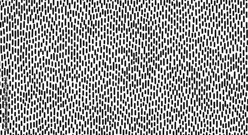 An abstract monochrome pattern of repeating small dashed lines creating a textured visual effect.