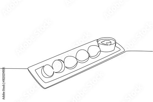 One line drawing of a long tray of falafel with tahini cup, an international event concept for International Falafel Day and, celebrating crunchy bites, pita wraps, and casual sharing