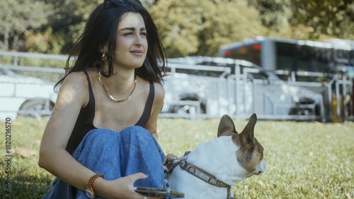 Woman Relaxing Outdoors with Her Dog in the Park
