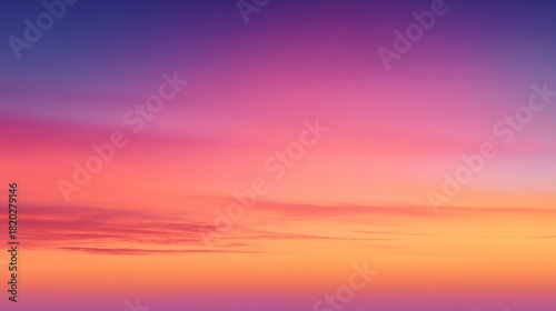 A vibrant sunset sky with hues of pink, purple, and orange, with scattered clouds and a clear horizon.