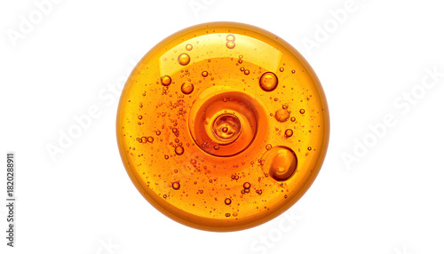 A golden orb of swirling liquid with bubbles against a stark black background