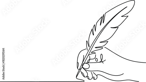 Hand holding quill pen writing on white background