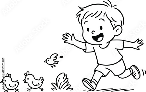 Happy boy chasing chickens in a field with smiling face