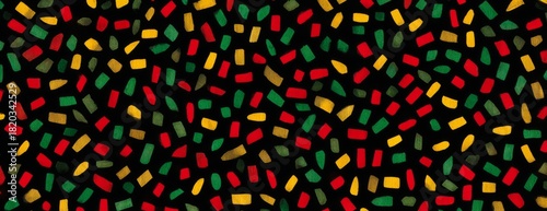 Colorful pattern of red, green, yellow, and black on dark background. Black History Month, Kwanzaa