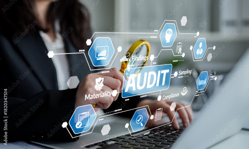 Naklejka premium A professional examines audit findings using a magnifying glass on a laptop, showcasing digital compliance and materiality analysis in a business context. Tessel