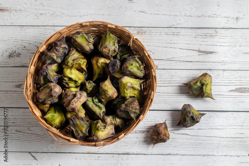 Water chestnut is a crunchy aquatic vegetable with sweet mild flavor, rich in fiber, antioxidants, vitamins, gluten-free, often used in snacks and curries.
