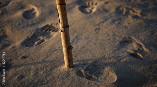The broken flagpole on the sandy ground left footprints of retreat, and the sunset symbolized surrender. Inspiring travel plans.