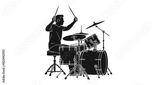 Musician playing drum set in a studio with microphones and lighting