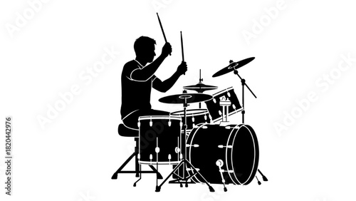 Dynamic silhouette of a musician passionately playing a drum kit, showcasing energetic musical performance