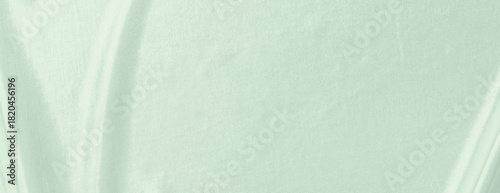 Soft mint green background with a smooth, fabric-like texture. The mint green background adds a calming, gentle feel. Minimal fabric vector background, simple fabric texture wallpaper
