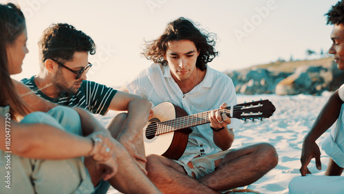 Beach, friends and play guitar on vacation, relax or bonding together outdoor for summer celebration. Seashore, group and people with acoustic instrument for travel music, song or party on holiday