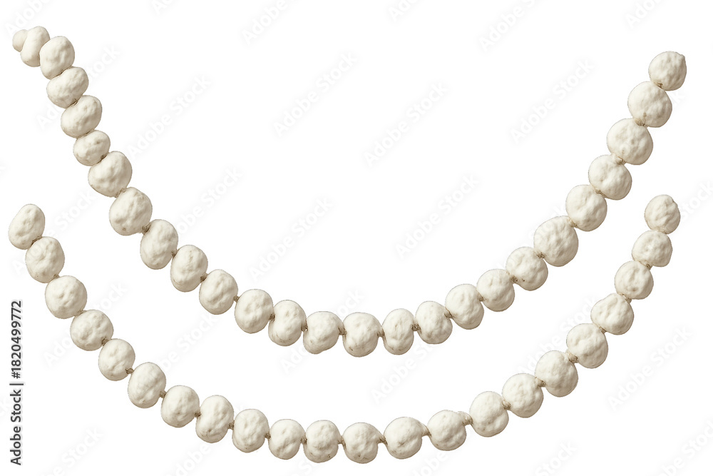 Obraz premium Two strands of a white cotton ball garland hang in a gentle curve for a rustic, natural, and festive holiday decoration with a soft and cozy texture