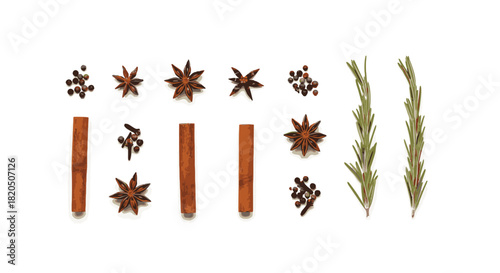 A collection of aromatic spices and herbs including star anise, cinnamon sticks, peppercorns, cloves, and rosemary sprigs arranged on a white background.
