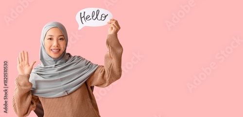 Young Muslim woman holding ...