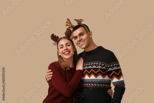 Happy young couple in reind...