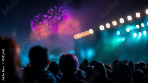 Wallpaper Mural Crowd watches colorful fireworks bursting in the night sky at a lively outdoor event with vibrant lights and blurred silhouettes creating a festive atmosphere Torontodigital.ca