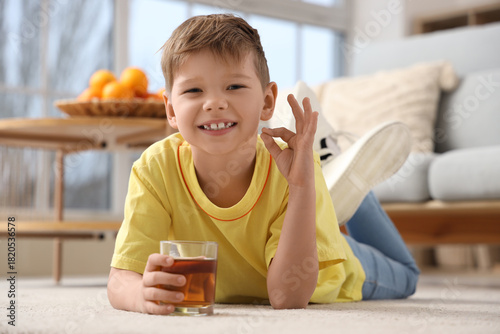 Cute little boy with glass ...