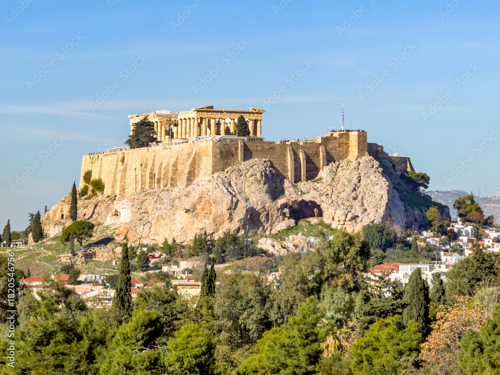Fototapeta premium Sunny daytime view of Acropolis hill in Athens