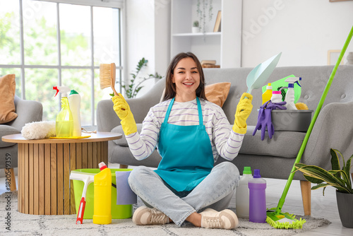 Female janitor with cleanin...