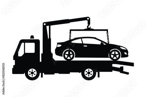 Tow truck lifting a car. Represents roadside assistance, vehicle recovery, and breakdown service