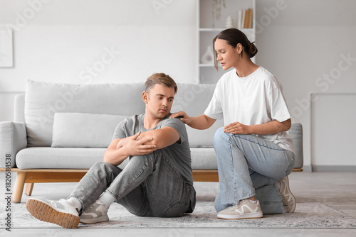 Young woman supporting man ...