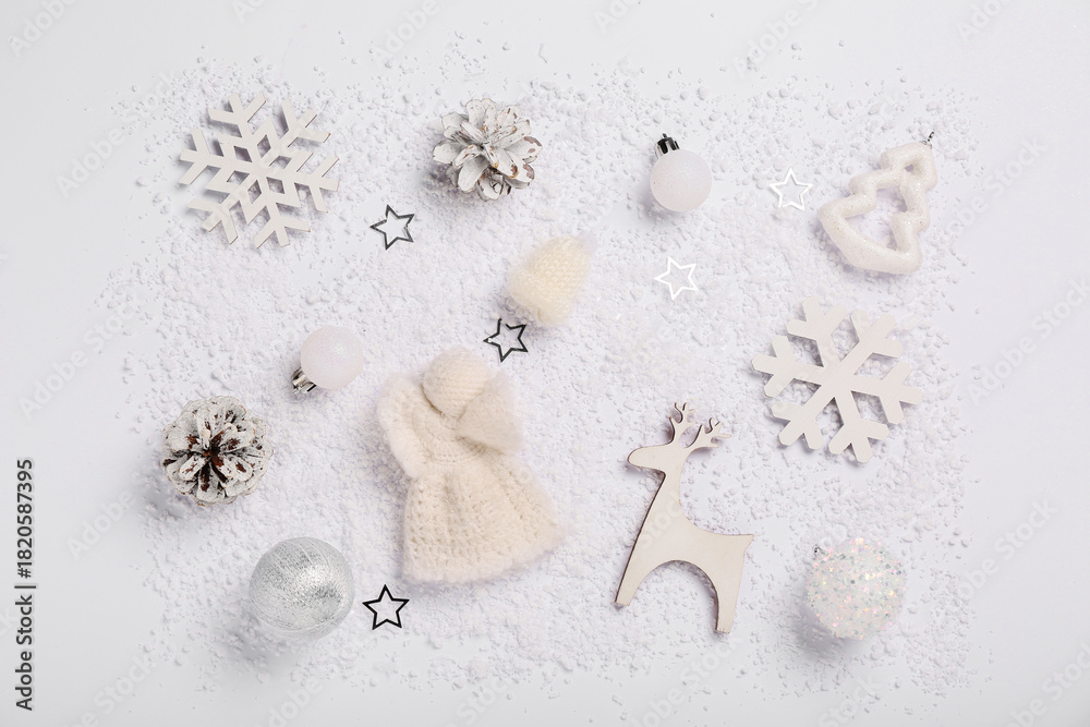 Fototapeta premium Composition with decorative snow, Christmas balls and decor on white background