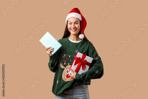 Happy young woman in Santa ...
