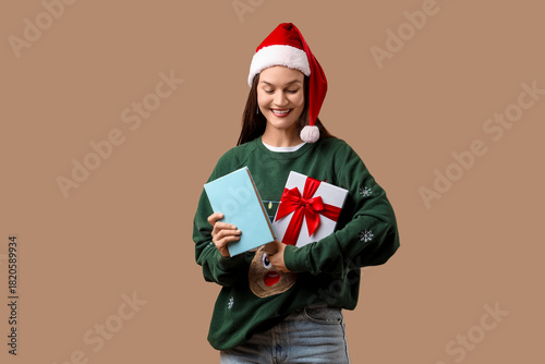 Happy young woman in Santa ...