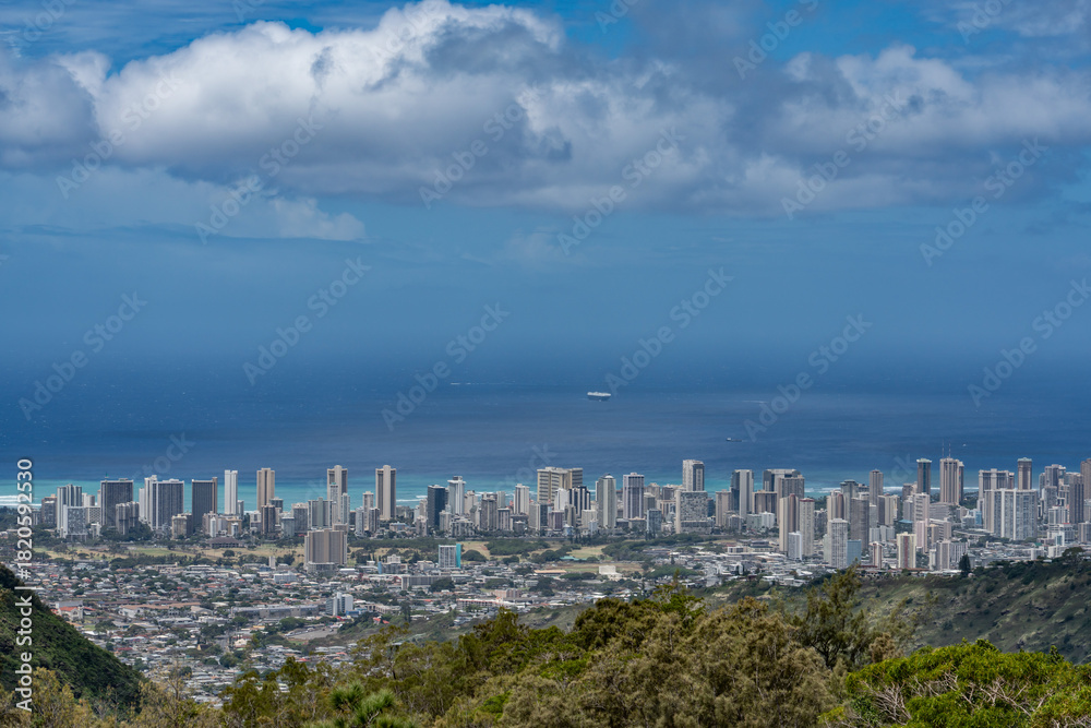 Naklejka premium In the distance is the city skyline of Honolulu. Mauʻumae Ridge Trail (Puʻu Lanipō), Honolulu, Oahu, Hawaii. Koʻolau Range(windward shield volcano). 