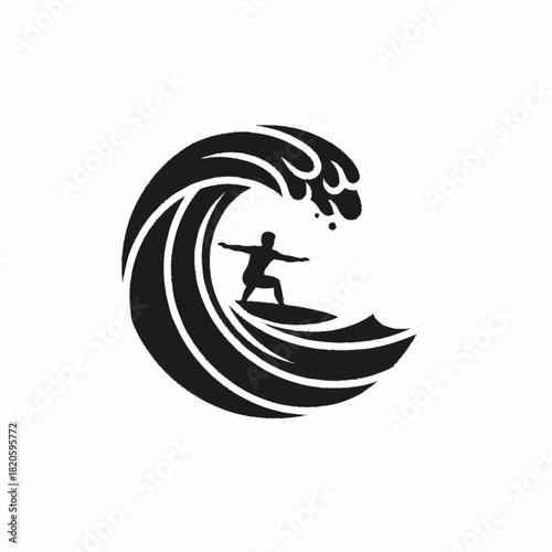 Surfer riding a massive wave silhouette in the ocean water.