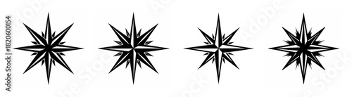 Four detailed black and white compass rose designs arranged horizontally side by side.