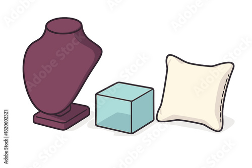 Collection of jewelry display props including necklace bust, clear cube, and small cushion