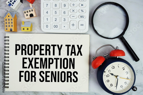 Tableau sur toile Property Tax Exemption For Seniors text written on notepad with house model, mag