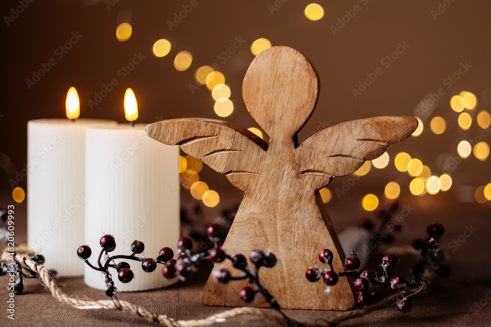 Naklejka premium Advent white candles with decor in shiny lights closeup