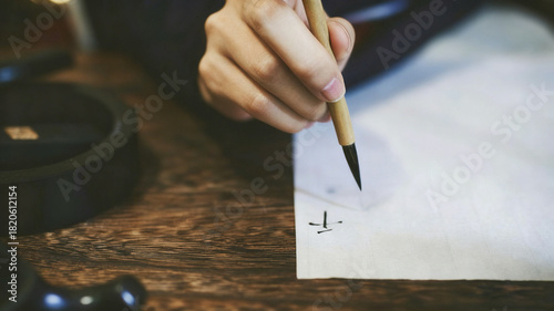 Dynamic Calligraphy Creation: The Art of Chinese Brush Strokes in a Serene Traditional Studio