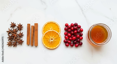 Festive holiday spice ingredients for mulled wine or cider on marble background, creating cozy seasonal vibes and a warm, inviting feeling