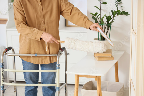 Mature woman with walker an...