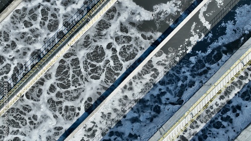 Photos Wastewater treatment plant aeration basins, industrial water treatment process,