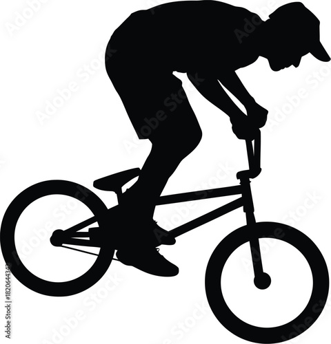 Silhouette of aBMX rider performing a trick on a bicycle against a white background bike