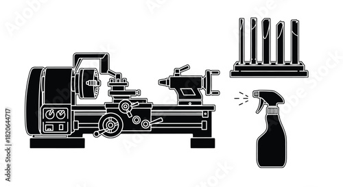 Precision metalworking lathe and tools for detailed crafting, with spray bottle for cleaning.