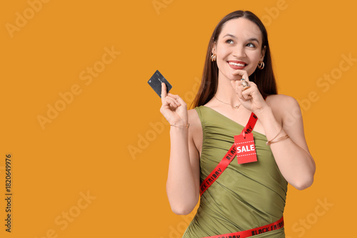 Thoughtful young woman in r...