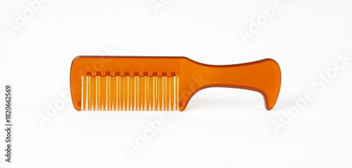 A brown plastic comb isolated on a pure white background,   plastic material,   texture