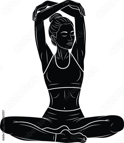Silhouette of a woman in a yoga pose with arms raised