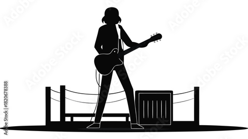 Silhouette of a musician passionately strumming an acoustic guitar outdoors capturing the essence of live performance and musical expression