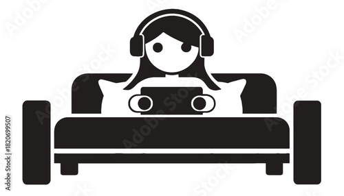Person relaxing on sofa with headphones and tablet, enjoying entertainment