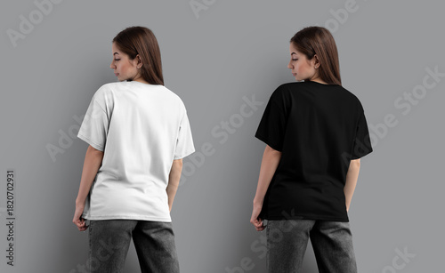 Template of a white, black oversized t-shirt on a girl in gray jeans, back view, for design, branding. Set of apparel