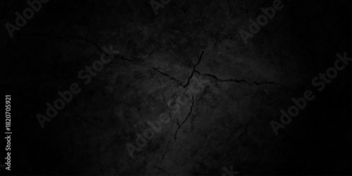 Black dark grunge stone texture with rough, natural crack wall surface background. uneven pattern resembling weathered black rock or charcoal. Panorama black canvas slate texture. marble background.