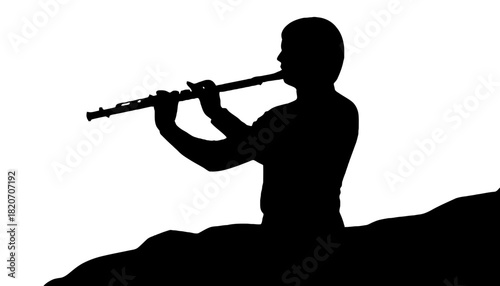 A silhouette of a man playing a flute on a hill